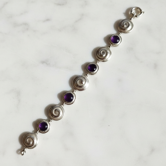 Bracciale Chiocciole Viola — laterale marmo bianco
